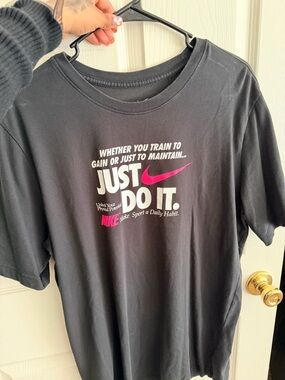 Nike Black T‑Shirt with Pink Swoosh and White Text